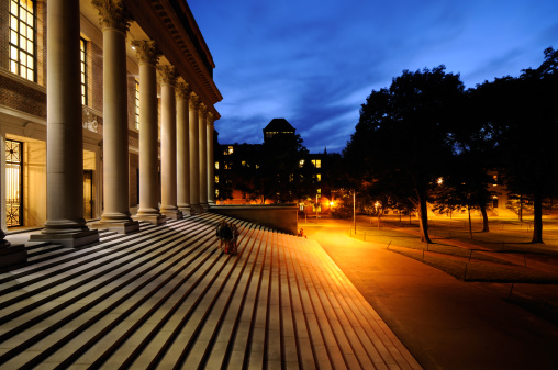 Harvard University library and campus at night. Success in education and tourist attraction in Cambridge, Massachusetts.